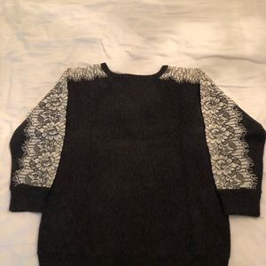 J Crew Charcoal, wool sweater with lace cut out sleeves.